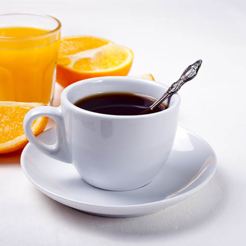 Cup of coffee and fruits and berries on the white background