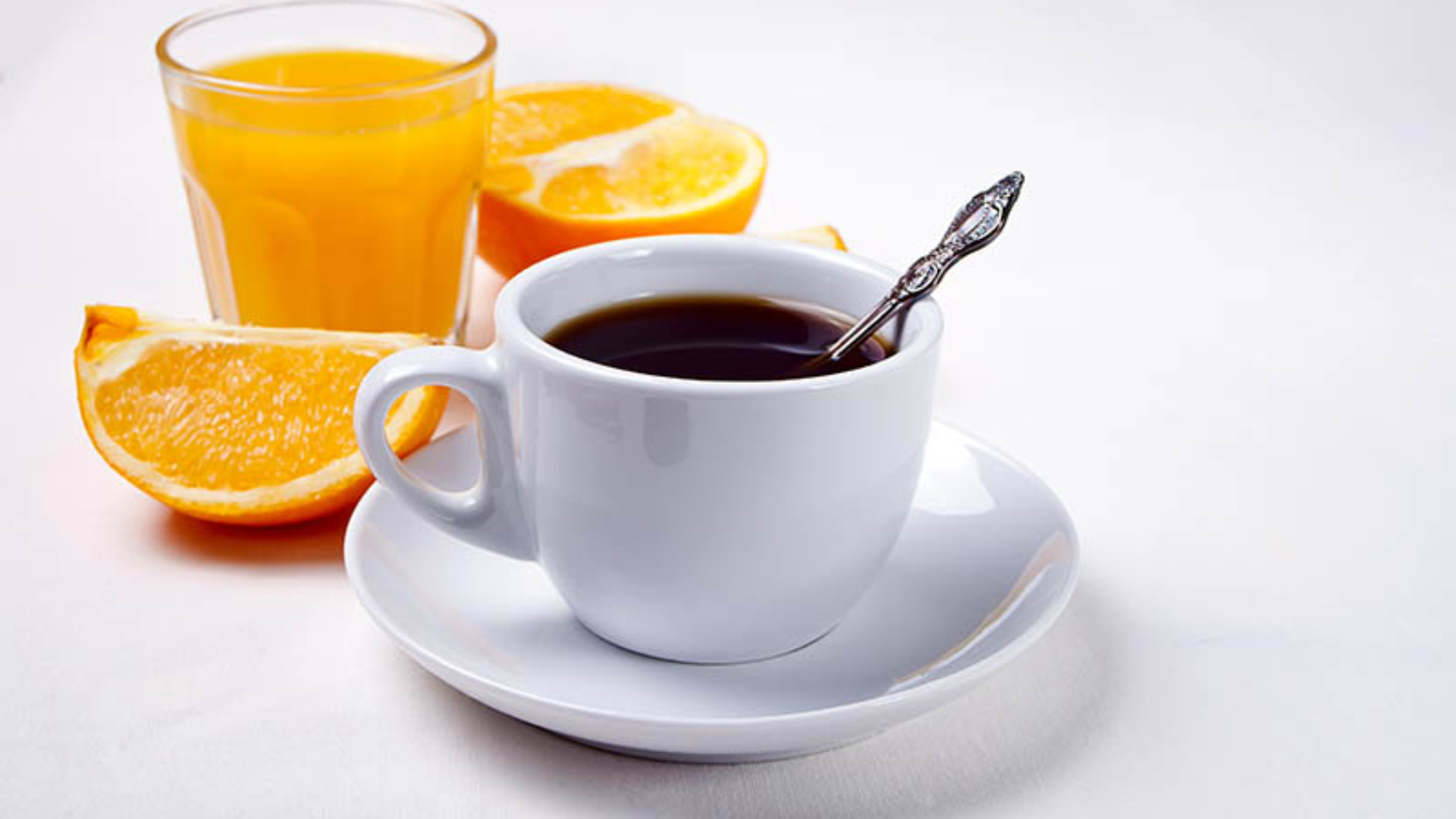 Cup of coffee and fruits and berries on the white background